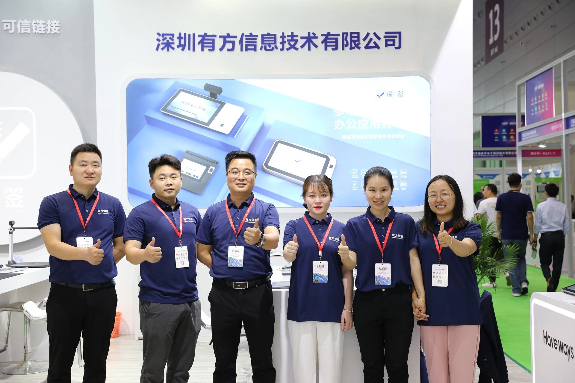 Haveways team at trade show booth for electronic signature pads